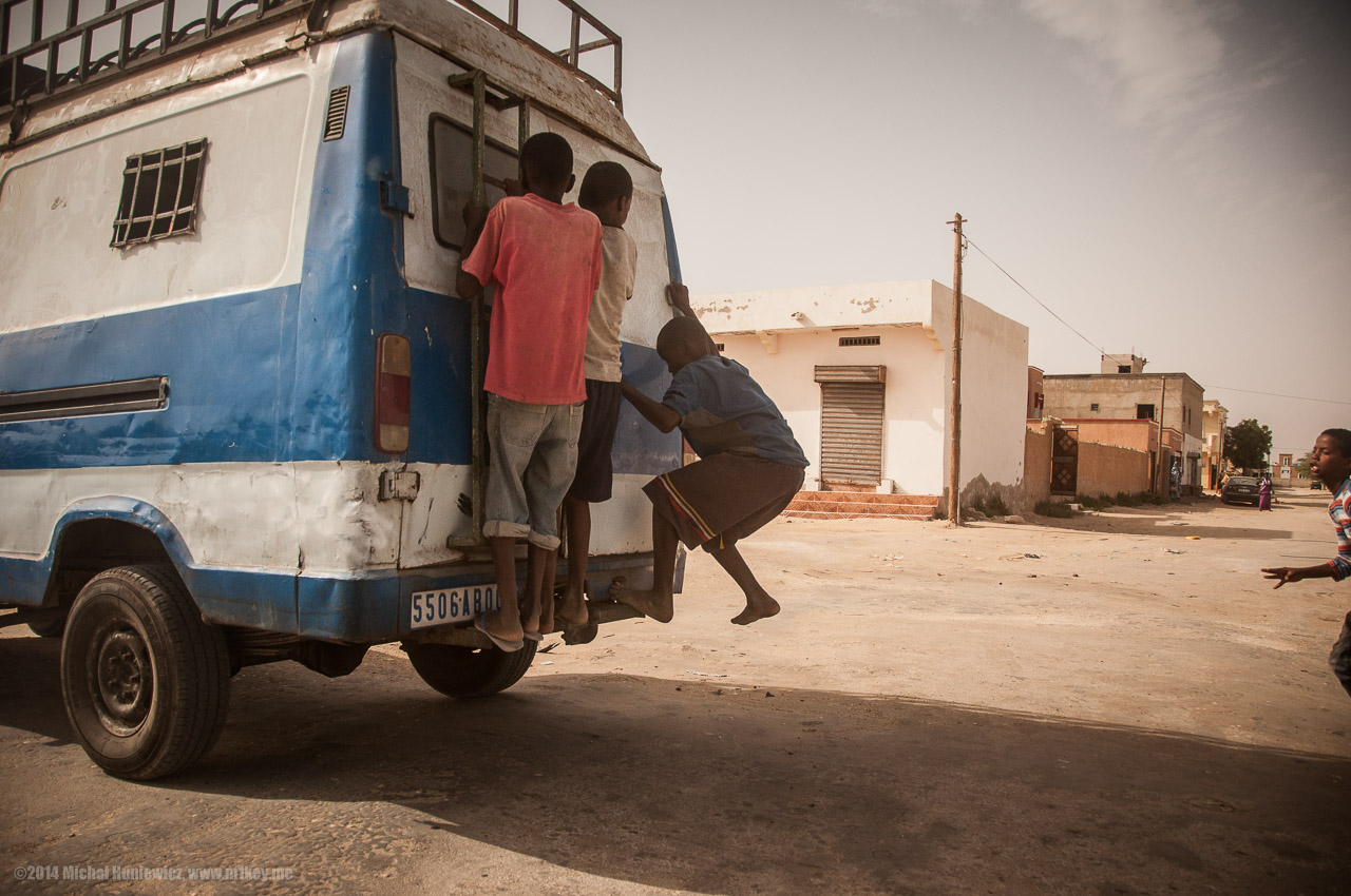 Kids Holding onto a Moving Car